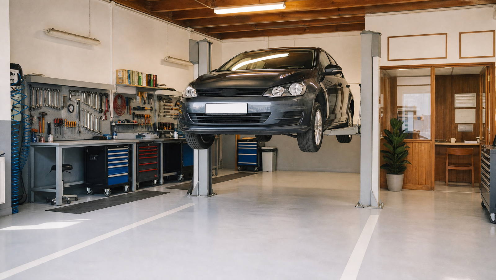 Garage automobile — atelier et pont, zone de travail réelle (exemple MOTIONEST)